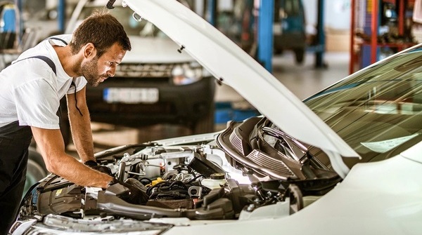 Professional automotive restoration workshop showcasing expert craftsmanship and modern equipment